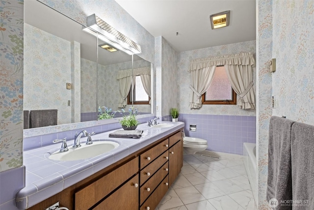 742 I St SW, Quincy, WA 98848 - bathroom with wallpapered walls, double vanity, toilet, and a tub