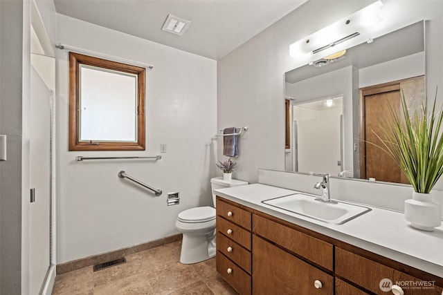 742 I St SW, Quincy, WA 98848 - full bathroom with vanity, baseboards, and toilet