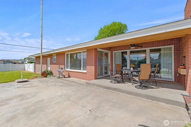 742 I St SW, Quincy, WA 98848 - rear view of house featuring a patio area, brick siding, and outdoor dining area