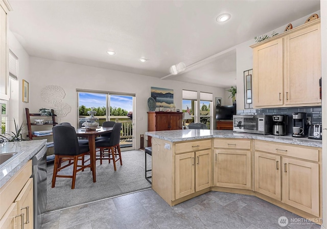 8412 Richard Way, Blaine, WA 98230 - kitchen with light brown cabinets, a peninsula, stainless steel dishwasher, and recessed lighting