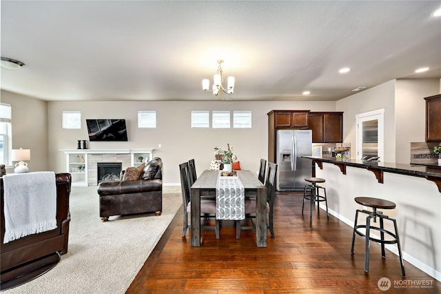 3827 Westar Ave SW, Bremerton, WA 98312 - dining space with a chandelier, recessed lighting, dark wood-style floors, and plenty of natural light