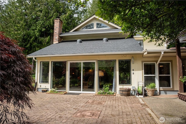 5363 Reese Hill Rd, Sumas, WA 98295 - back of property featuring a chimney, a patio, and a shingled roof