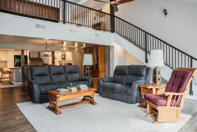 5363 Reese Hill Rd, Sumas, WA 98295 - living area with wood finished floors, a ceiling fan, stairs, and a towering ceiling