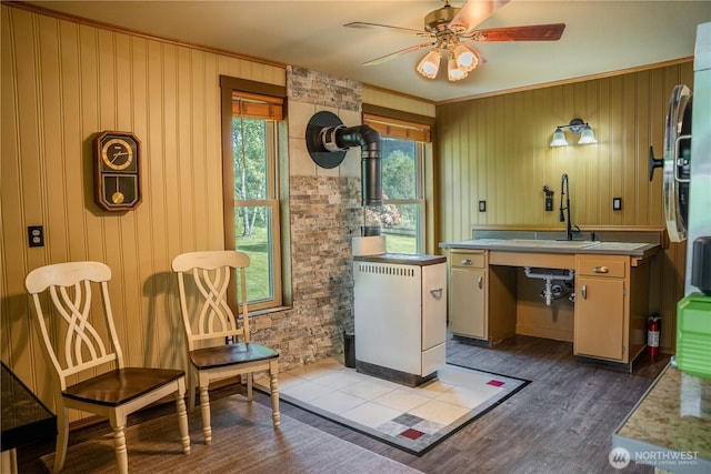 5363 Reese Hill Rd, Sumas, WA 98295 - kitchen featuring a sink, crown molding, dark wood-style flooring, a ceiling fan, and wooden walls