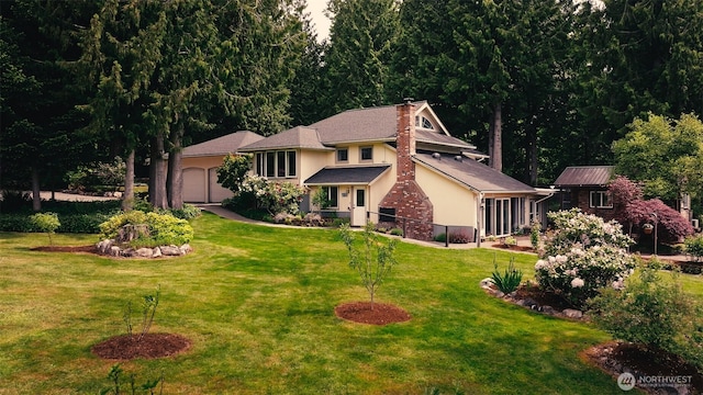 5363 Reese Hill Rd, Sumas, WA 98295 - view of front of home with stucco siding, an attached garage, and a front lawn