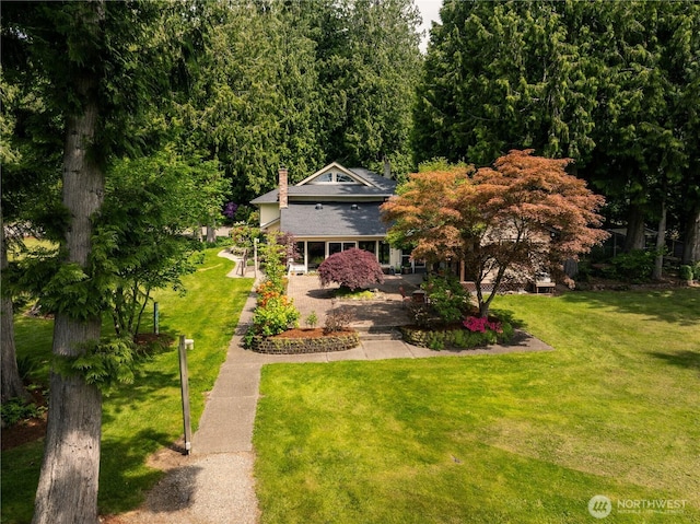 5363 Reese Hill Rd, Sumas, WA 98295 - view of front facade with a front yard, a chimney, and covered porch