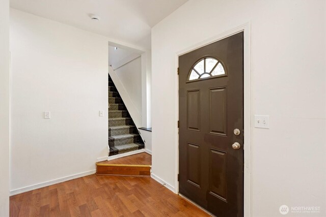 12 Fairgrounds Rd, Skamokawa, WA 98647 - entrance foyer featuring stairs, wood finished floors, and baseboards