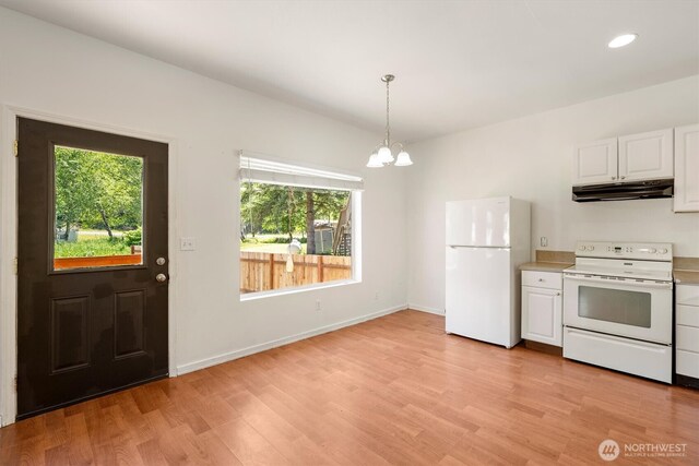 12 Fairgrounds Rd, Skamokawa, WA 98647 - kitchen featuring white appliances, under cabinet range hood, plenty of natural light, white cabinets, and recessed lighting