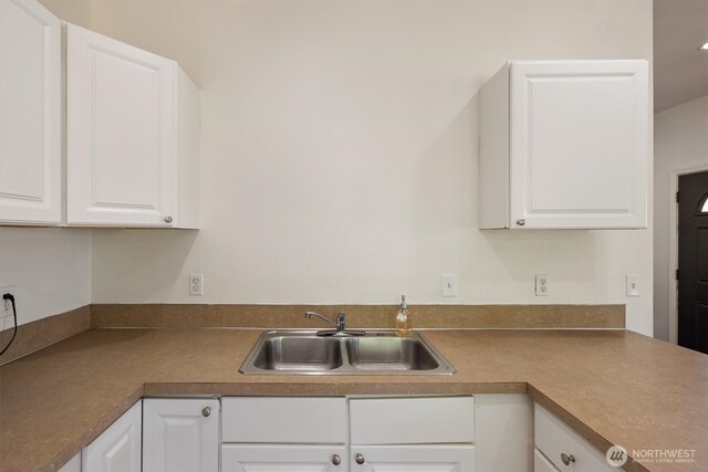 12 Fairgrounds Rd, Skamokawa, WA 98647 - kitchen featuring a sink, white cabinetry, and dark countertops
