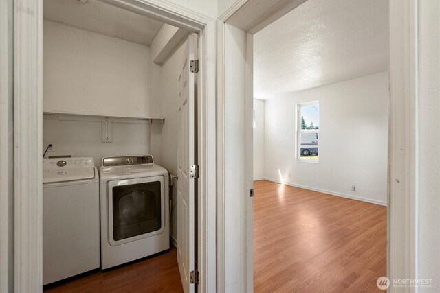 12 Fairgrounds Rd, Skamokawa, WA 98647 - laundry area featuring washer and dryer and wood finished floors