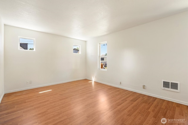 12 Fairgrounds Rd, Skamokawa, WA 98647 - unfurnished room featuring plenty of natural light, light wood-style floors, and baseboards