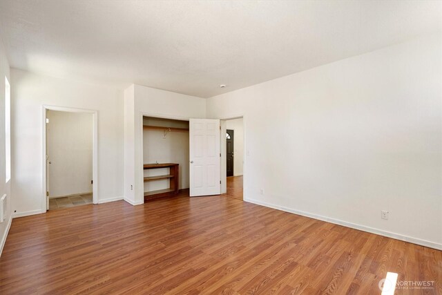 12 Fairgrounds Rd, Skamokawa, WA 98647 - unfurnished bedroom featuring light wood finished floors, baseboards, and a closet