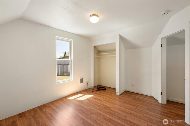 12 Fairgrounds Rd, Skamokawa, WA 98647 - unfurnished bedroom featuring lofted ceiling and wood finished floors