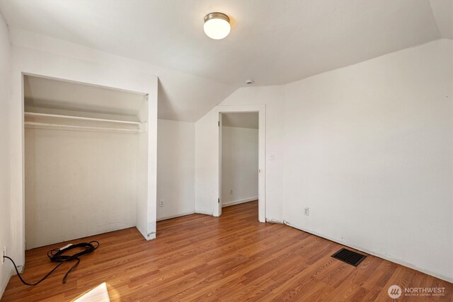12 Fairgrounds Rd, Skamokawa, WA 98647 - unfurnished bedroom featuring lofted ceiling, light wood-style floors, and a closet