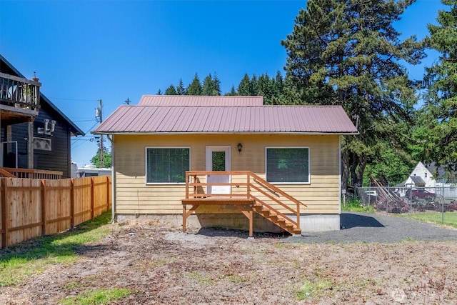 12 Fairgrounds Rd, Skamokawa, WA 98647 - rear view of property featuring metal roof and a wooden deck