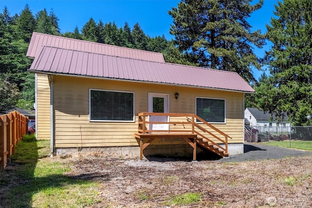 12 Fairgrounds Rd, Skamokawa, WA 98647 - view of front of house featuring a deck, metal roof, and stairway