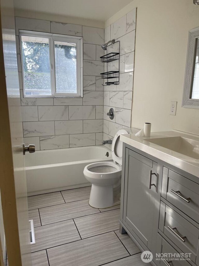27 SW 102nd St, Seattle, WA 98146 - full bath featuring vanity, plenty of natural light, toilet, and  shower combination