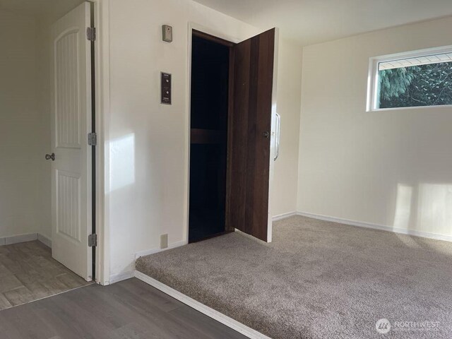 27 SW 102nd St, Seattle, WA 98146 - empty room with baseboards and wood finished floors