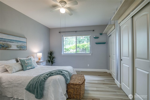 566 Duck Lake Dr SE, Ocean Shores, WA 98569 - bedroom featuring light wood-style floors, baseboards, a ceiling fan, and a closet