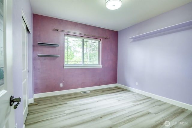 566 Duck Lake Dr SE, Ocean Shores, WA 98569 - empty room featuring wood finished floors and baseboards