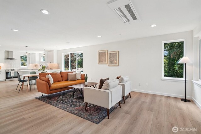 20313B 14th Ave NE, Shoreline, WA 98155 - living room featuring light wood-style flooring, recessed lighting, and baseboards