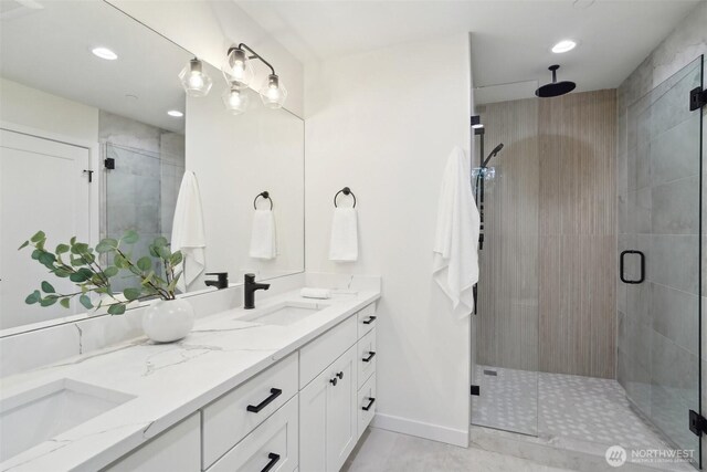 20313B 14th Ave NE, Shoreline, WA 98155 - bathroom featuring double vanity, a shower stall, recessed lighting, baseboards, and tile patterned flooring