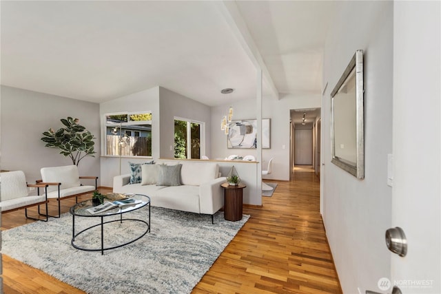 3907 SW 102nd St, Seattle, WA 98146 - living room with light wood finished floors, baseboards, and a chandelier