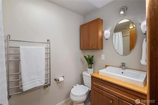 3907 SW 102nd St, Seattle, WA 98146 - full bath with toilet, vanity, baseboards, a towel warmer, and curtained shower