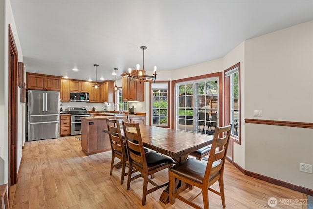 12606 Icicle Ln, Leavenworth, WA 98826 - dining room with a chandelier, light wood-style flooring, baseboards, and recessed lighting