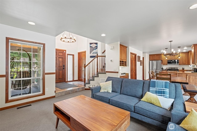 12606 Icicle Ln, Leavenworth, WA 98826 - living area with a chandelier, light colored carpet, stairs, baseboards, and recessed lighting