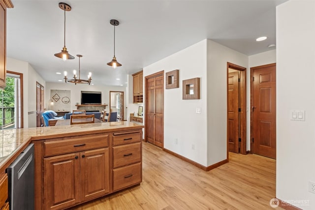 12606 Icicle Ln, Leavenworth, WA 98826 - kitchen featuring dishwasher, open floor plan, light wood-style flooring, recessed lighting, and a chandelier
