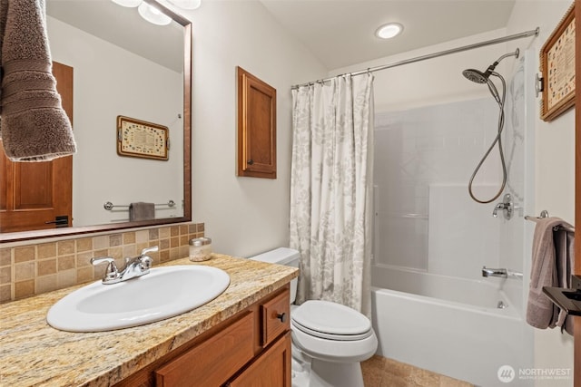 12606 Icicle Ln, Leavenworth, WA 98826 - full bathroom featuring toilet, vanity, shower / bath combination with curtain, and tasteful backsplash