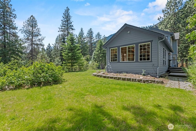 12606 Icicle Ln, Leavenworth, WA 98826 - view of property exterior with a yard