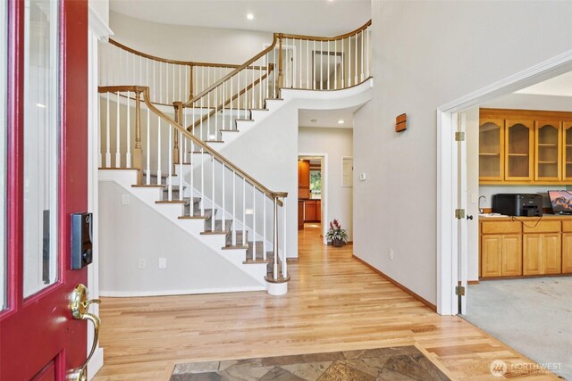 18913 SE 174th Way, Renton, WA 98058 - entryway featuring stairway, a towering ceiling, wood finished floors, baseboards, and recessed lighting