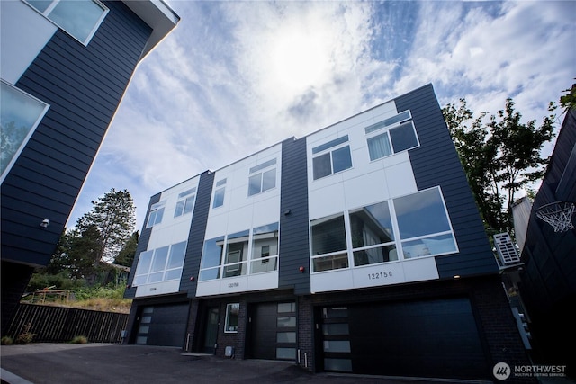 12215 Des Moines Memorial Dr S Unit A, Burien, WA 98168 - view of building exterior featuring a garage