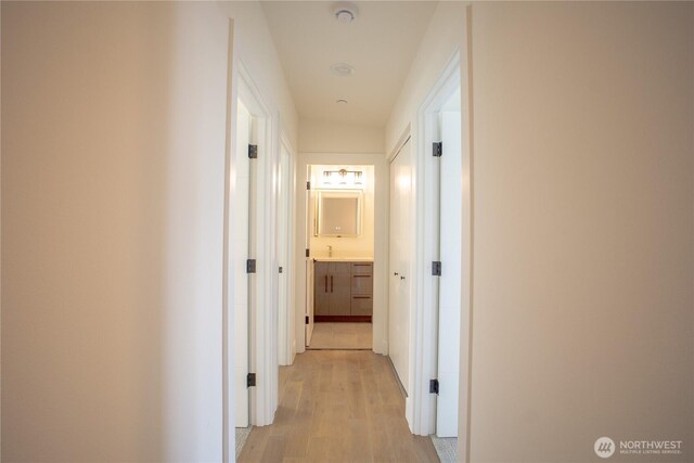 12215 Des Moines Memorial Dr S Unit A, Burien, WA 98168 - hall featuring light wood-style flooring and a sink