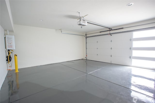 12215 Des Moines Memorial Dr S Unit A, Burien, WA 98168 - garage with a garage door opener and tankless water heater