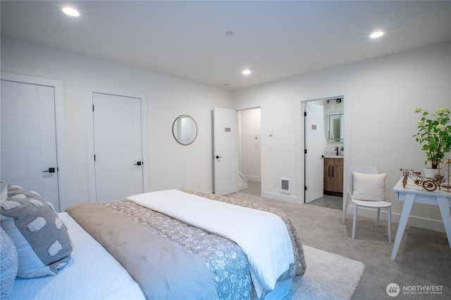 12215 Des Moines Memorial Dr S Unit A, Burien, WA 98168 - bedroom with light colored carpet, recessed lighting, and ensuite bath