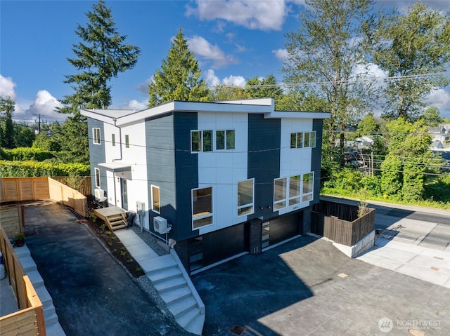 12215 Des Moines Memorial Dr S Unit A, Burien, WA 98168 - back of house featuring a garage and cooling unit