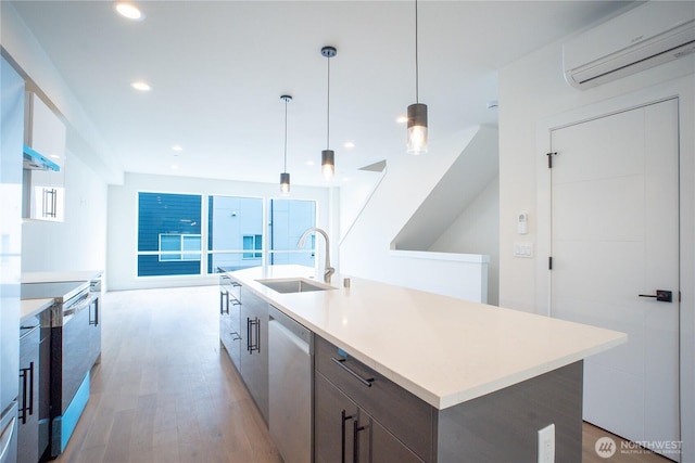 12215 Des Moines Memorial Dr S Unit A, Burien, WA 98168 - kitchen with an AC wall unit, stainless steel appliances, light wood-type flooring, modern cabinets, and recessed lighting