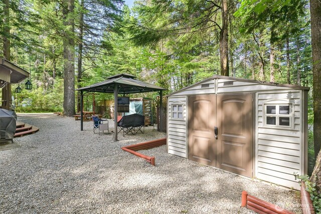 1190 Exit Rd, Maple Falls, WA 98266 - view of shed featuring a gazebo and view of wooded area
