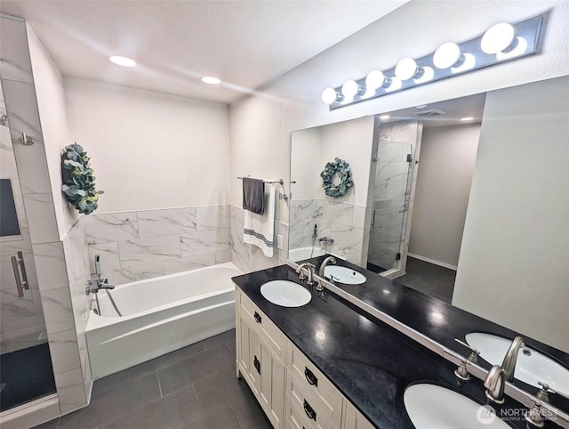 3163 Walker Rd, Dupont, WA 98327 - bathroom featuring a stall shower, a bath, double vanity, tile patterned floors, and recessed lighting
