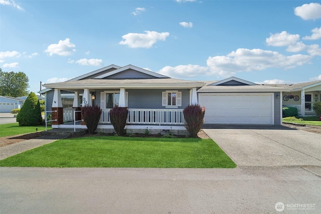 302 Oak St SW, Orting, WA 98360 - ranch-style house featuring covered porch, an attached garage, a front lawn, and concrete driveway