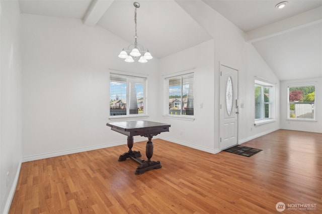 302 Oak St SW, Orting, WA 98360 - entrance foyer with wood finished floors, a chandelier, and baseboards