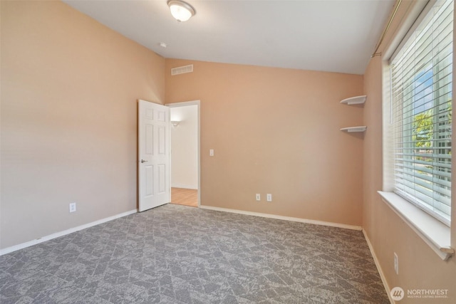 302 Oak St SW, Orting, WA 98360 - carpeted empty room featuring lofted ceiling and baseboards
