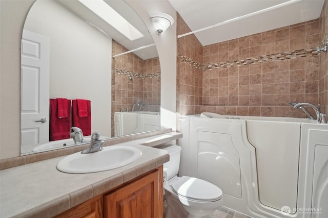 302 Oak St SW, Orting, WA 98360 - full bath with toilet, vanity, and shower / bath combination