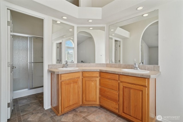 302 Oak St SW, Orting, WA 98360 - bathroom featuring recessed lighting, double vanity, and a shower stall