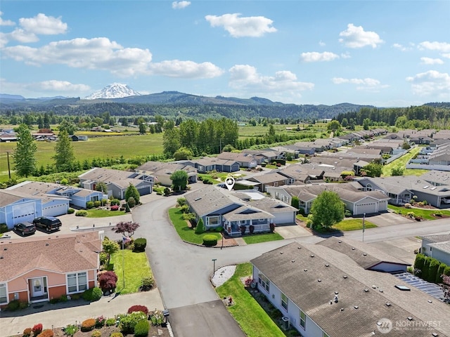 302 Oak St SW, Orting, WA 98360 - aerial view of residential area featuring a mountain backdrop