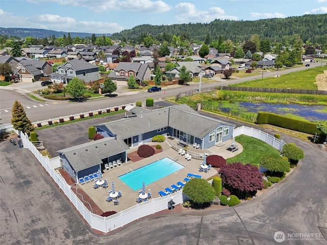 302 Oak St SW, Orting, WA 98360 - aerial view of residential area with a pool area and a forest