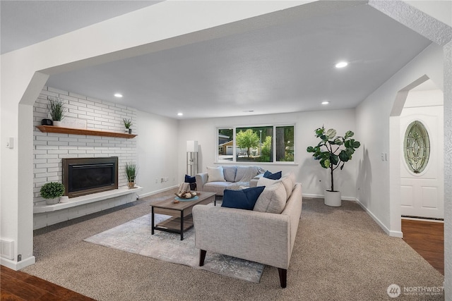 5505 Windemere Dr SE, Olympia, WA 98501 - living room featuring a fireplace, recessed lighting, baseboards, carpet, and wood finished floors